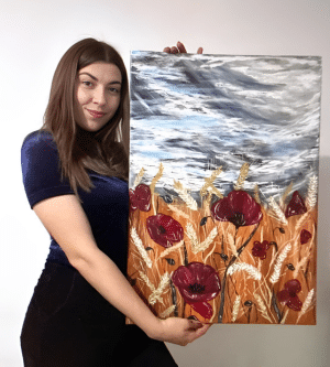 Send me a message! Cristina holding a painting